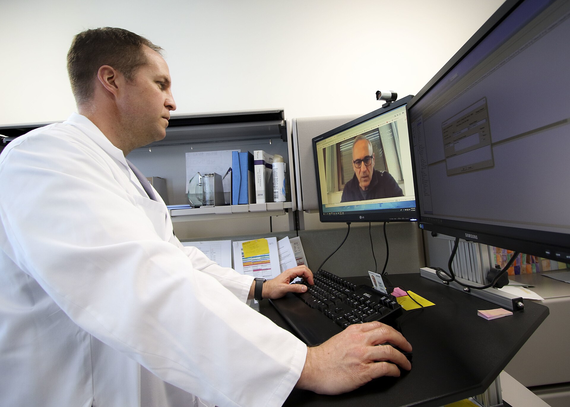 A military physician conducting a virtual healthcare appointment